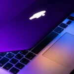 slightly opened silver MacBook