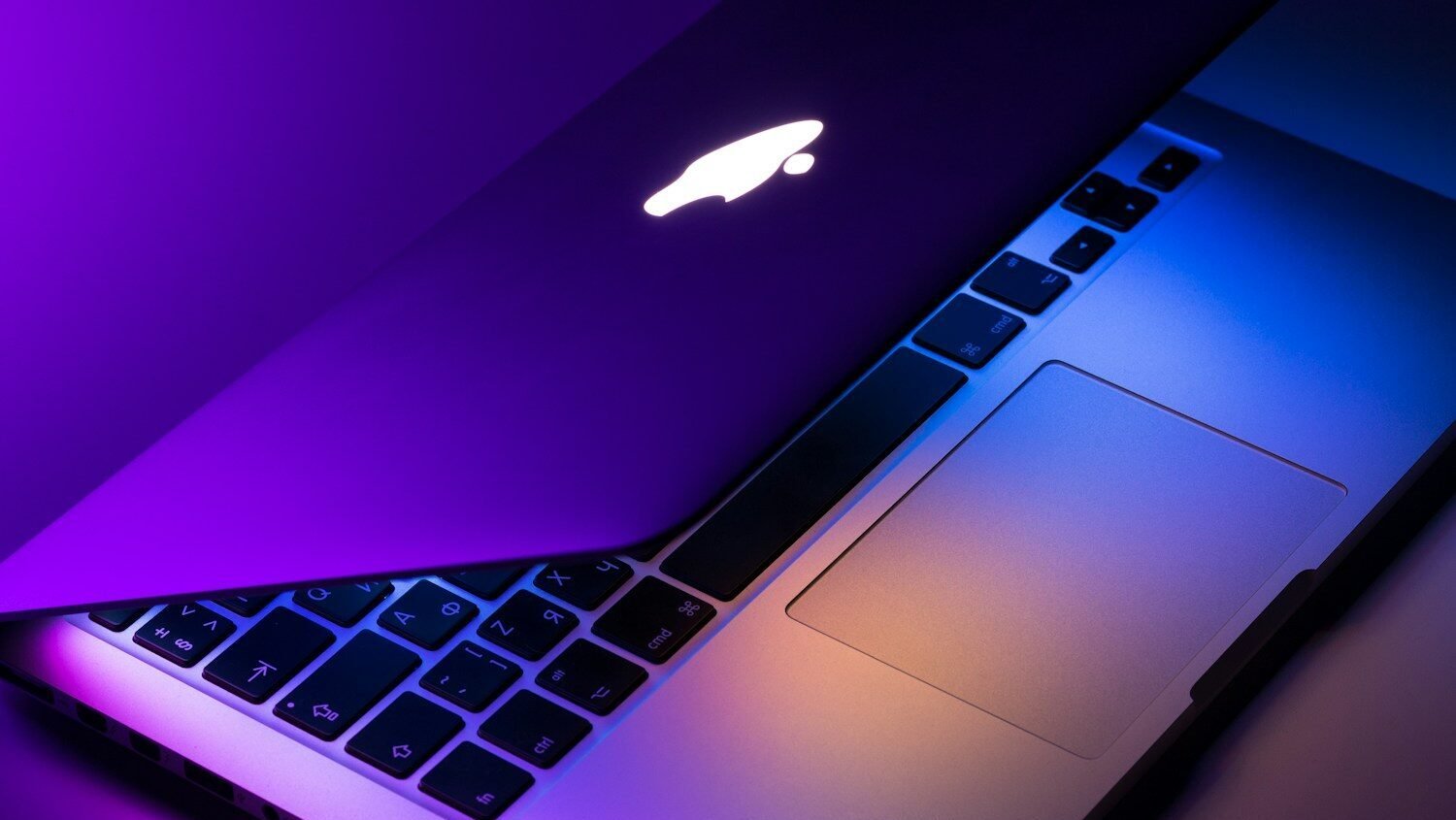 slightly opened silver MacBook